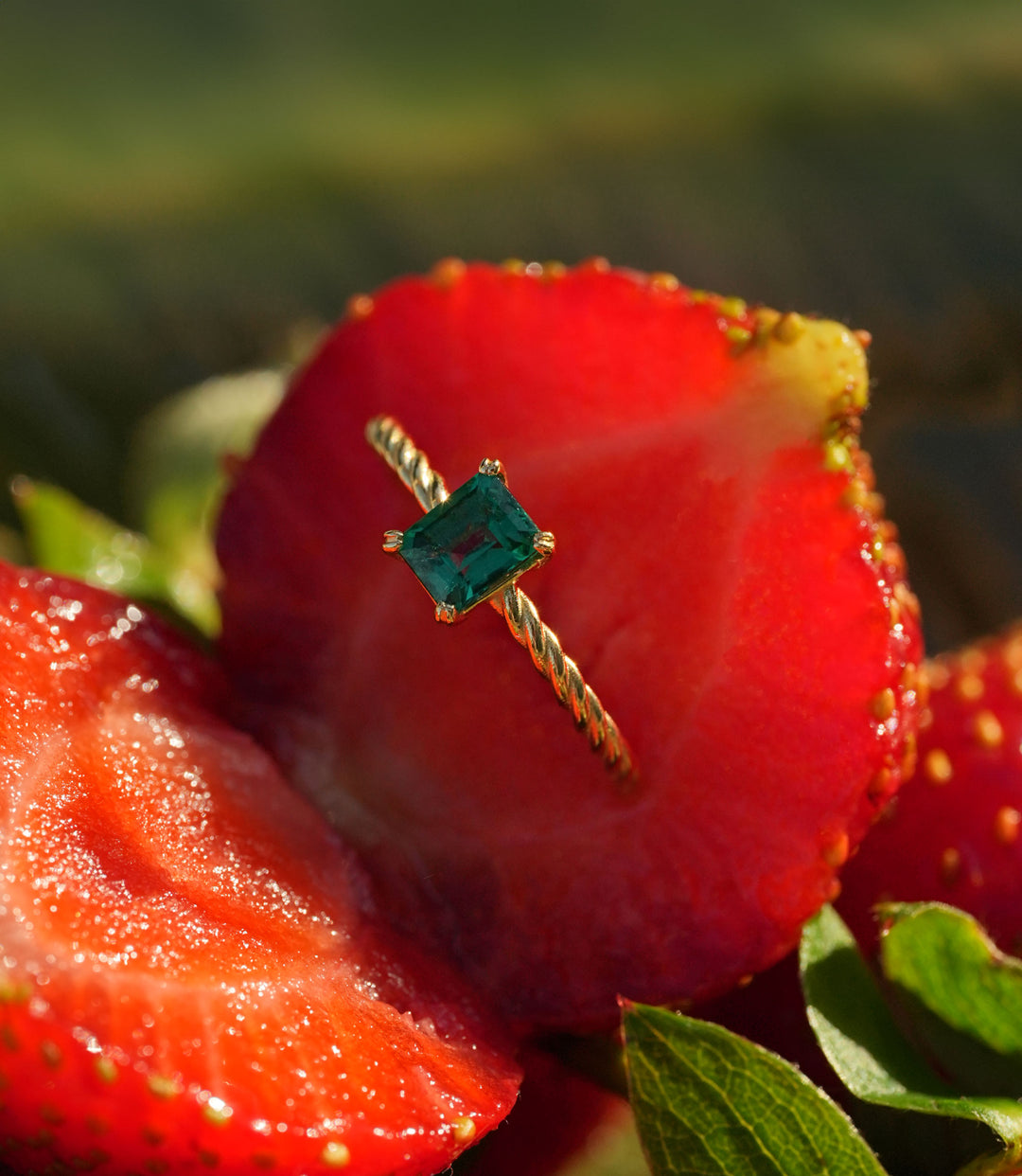 Gold emerald ring from The O Collection’s SS2024 line, featuring a minimalist design.