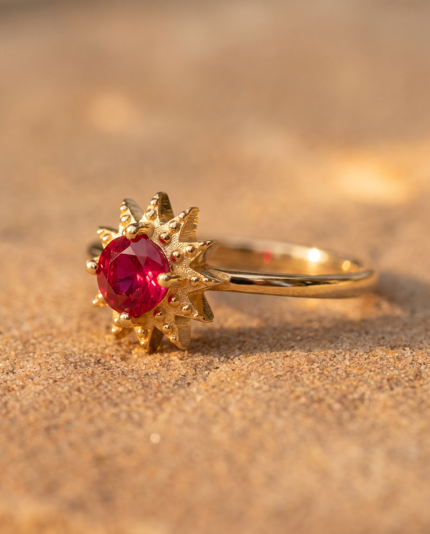 The Astrella Ring macro detail of ruby and gold setting