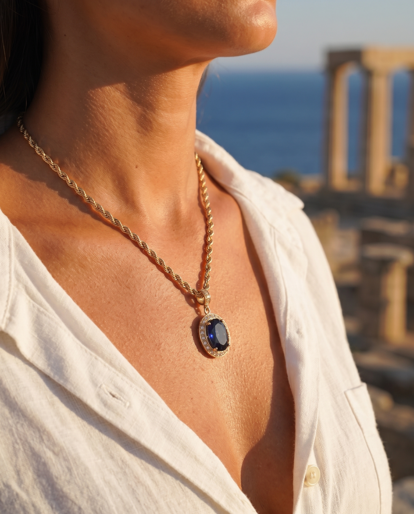Aegean Jewel Pendant worn at the decolletage overlooking the sea