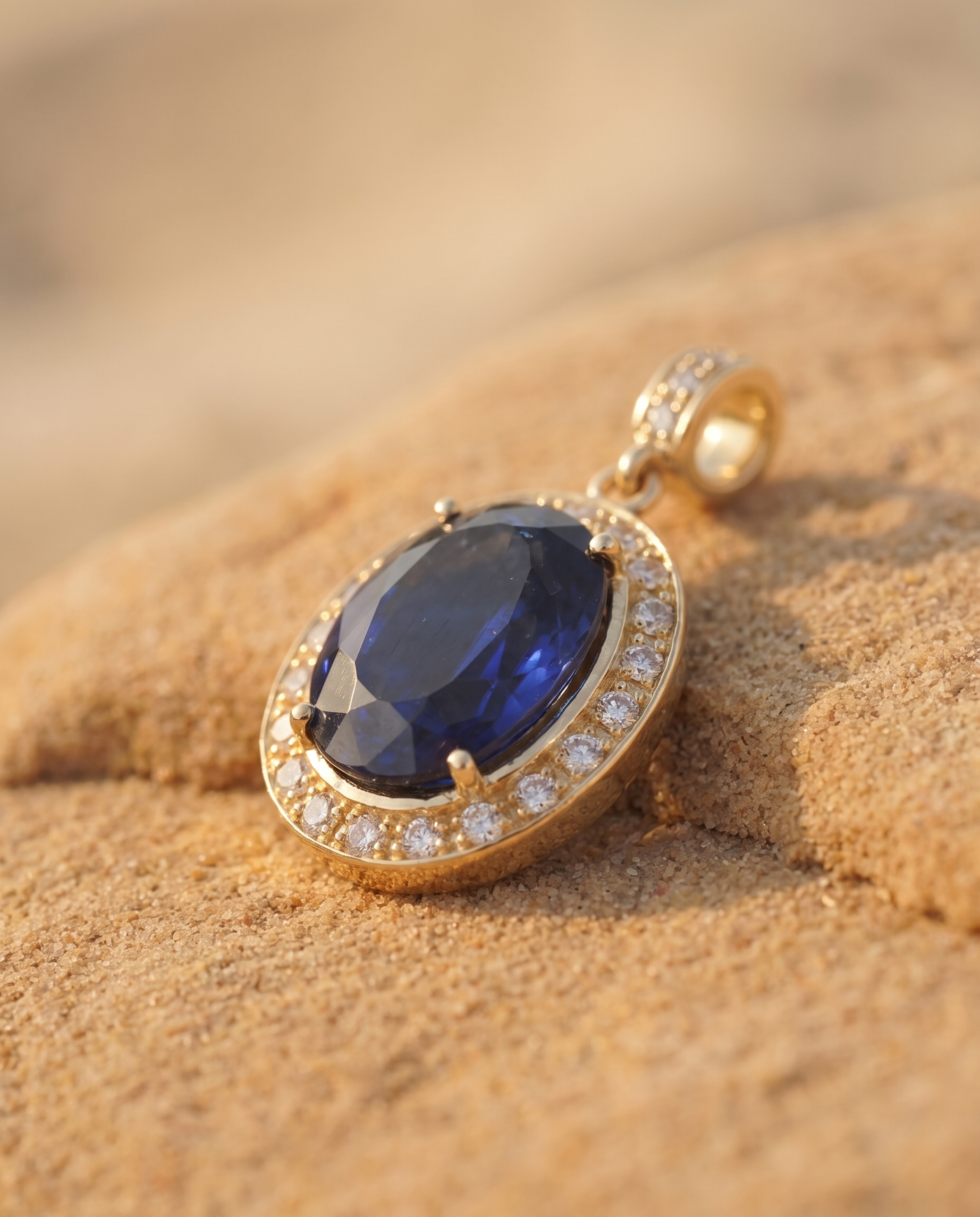 Aegean Jewel Pendant macro detail of blue sapphire and diamond halo