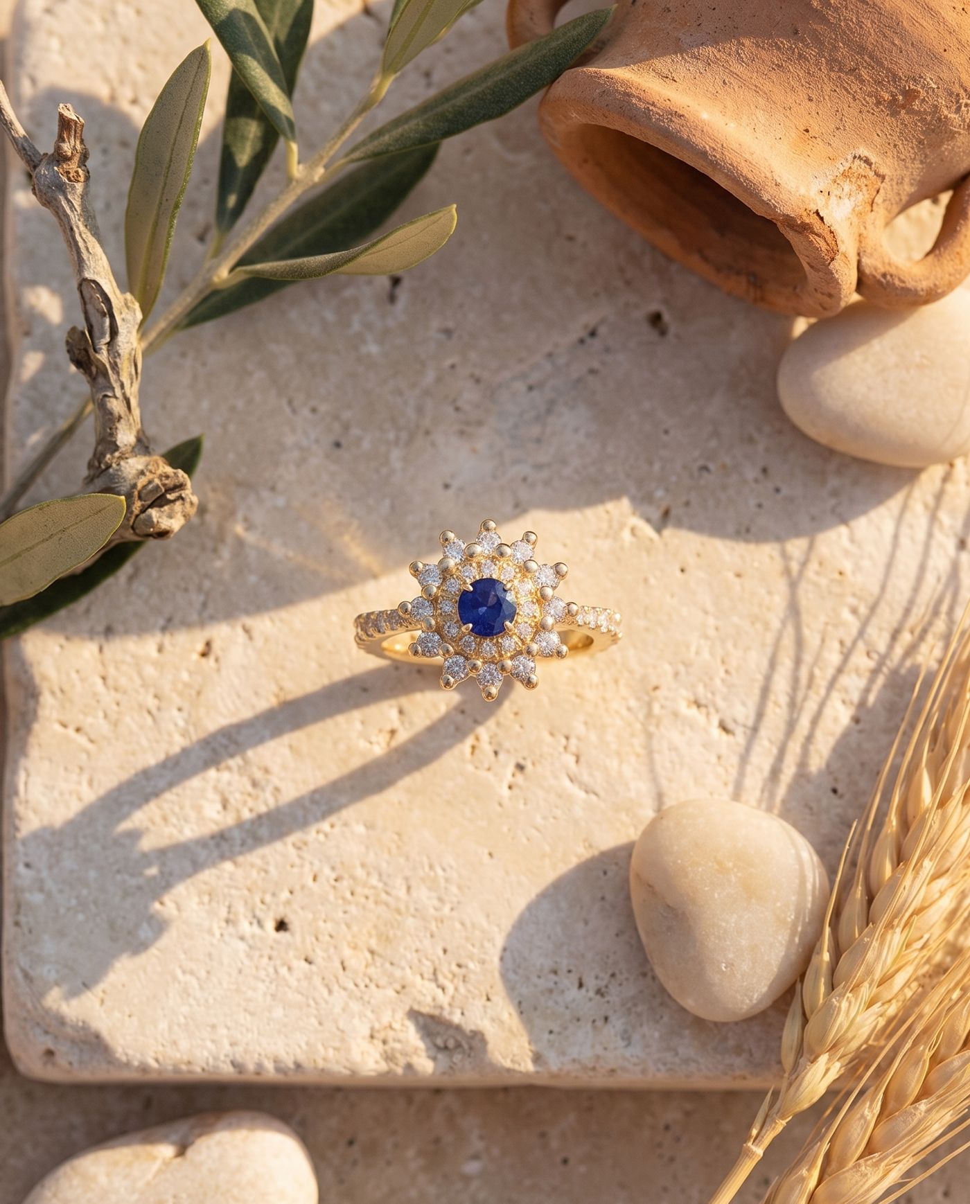 The Fiore Blue Sapphire Ring styled flat-lay with Mediterranean props