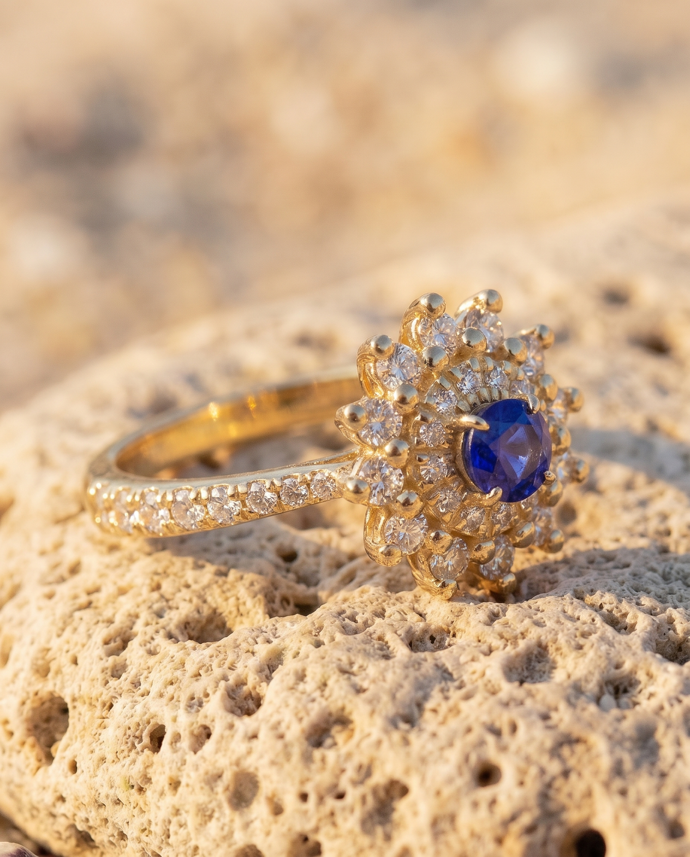 The Fiore Blue Sapphire Ring macro detail of sapphire and diamond halo