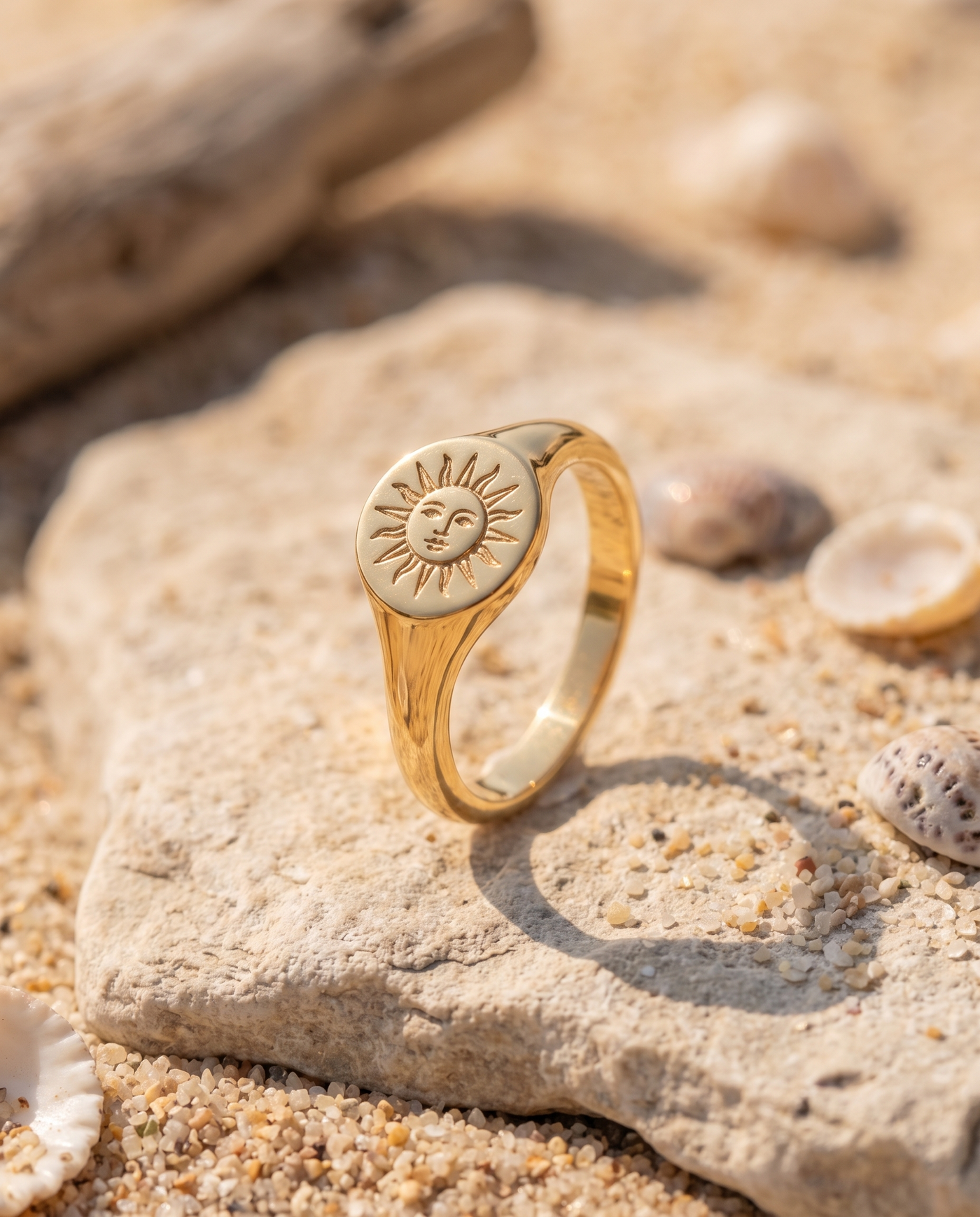 Solare Signet Ring on an Aegean beach stone at golden hour