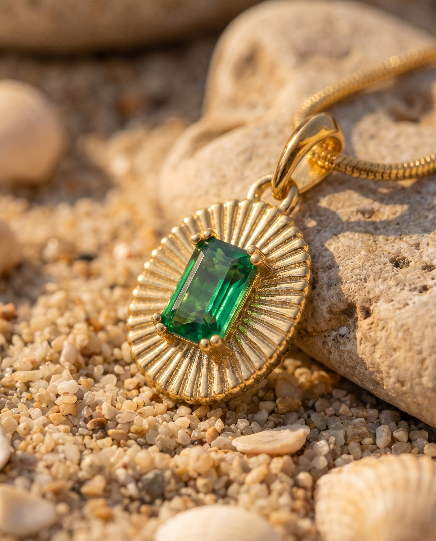 Emerald Sunburst Pendant macro detail of emerald and sunburst goldwork