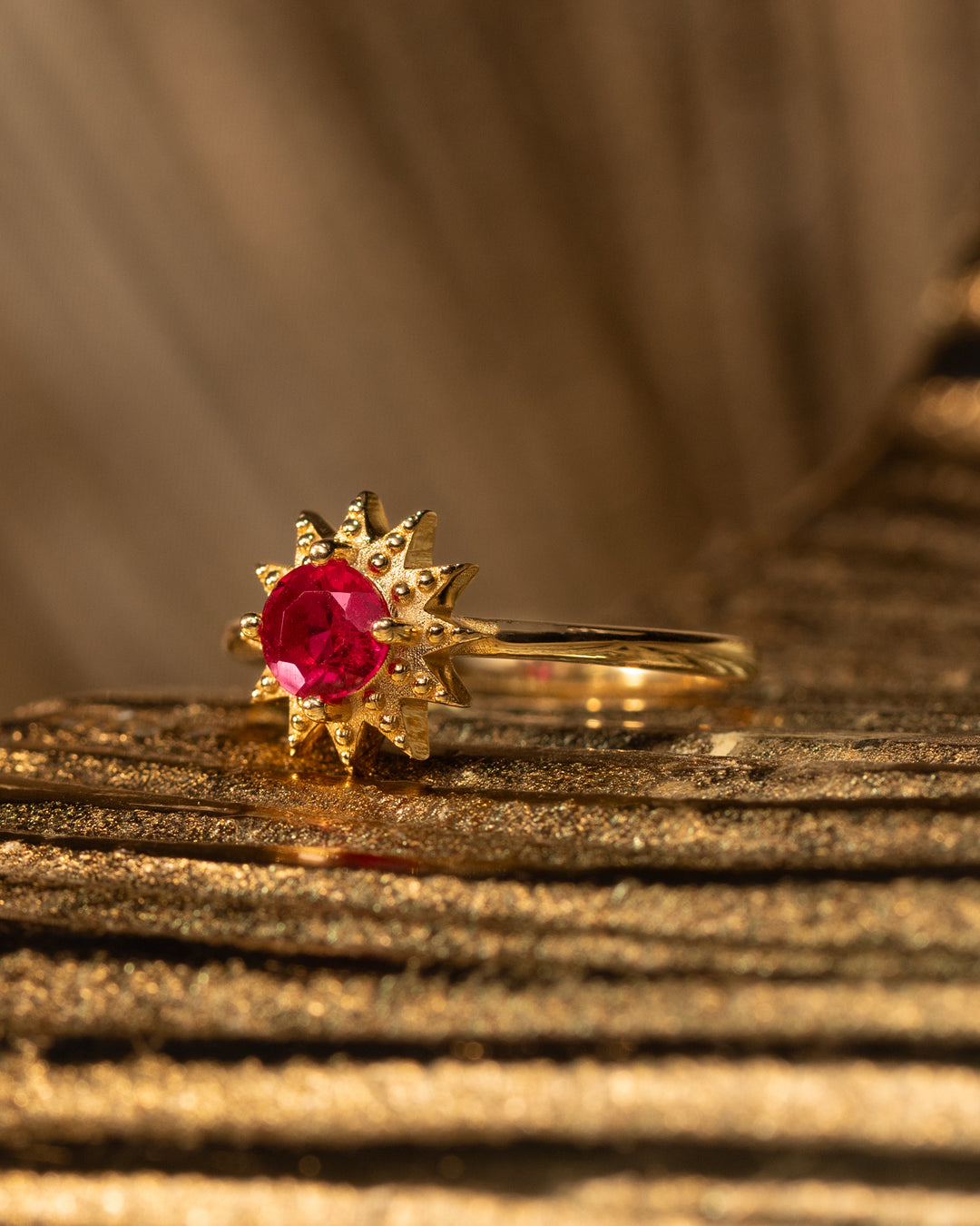 Astrella Ring by O Collection — 14k gold starburst ring with round ruby center, inspired by Mediterranean sun and celestial elegance