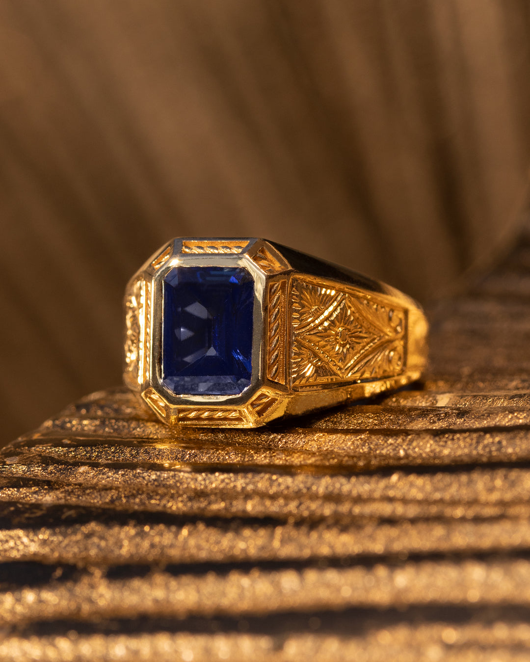 Constantin Ring by O Collection — 14k gold engraved ring with emerald-cut blue sapphire and ornate hand-carved detailing, inspired by Byzantine and Mediterranean design