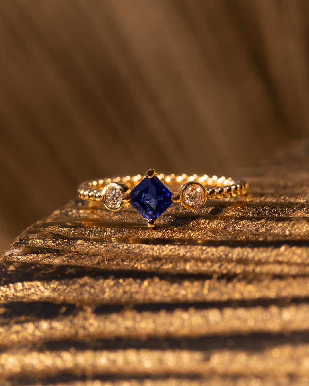 Stella Ring by O Collection — 14k gold ring with square sapphire, two round diamonds, and beaded band, inspired by celestial Mediterranean design